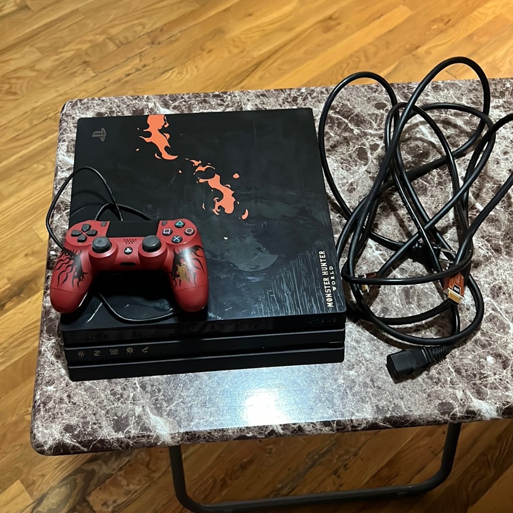 PlayStation 4 Monster Hunter World console and 1 remote